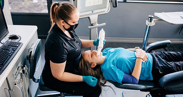 Clear Blue Smiles patient working with a Smile Center orthodontist